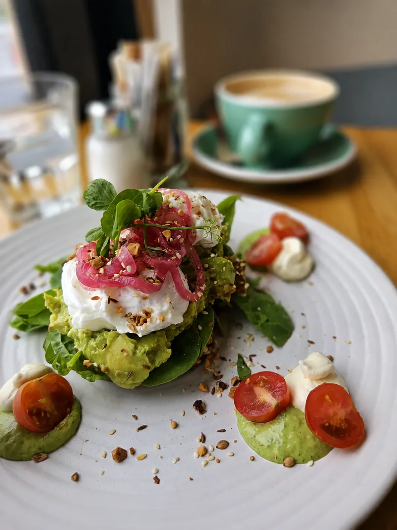 Poached eggs and smashed avocado on toast at Yellow