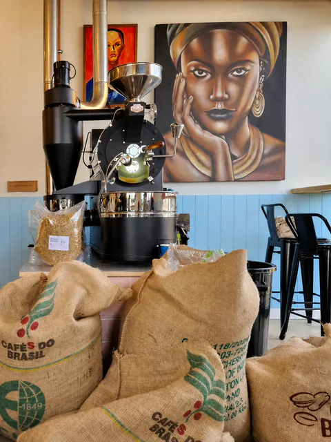 Coffee roaster and bean sacks inside Yellow